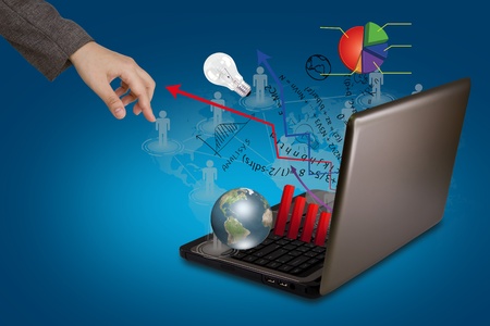 Laptop and financial Graphsの写真素材