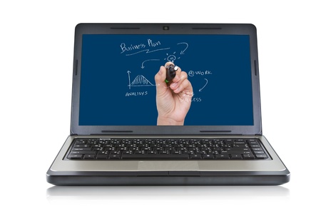 Businesswoman drawing a strategic business plan on screen laptopの写真素材