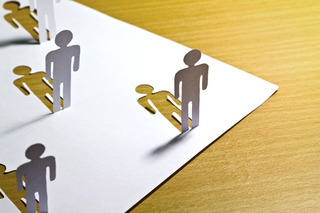 Social Network concept : close up of people cut out of paper on wooden tableの写真素材