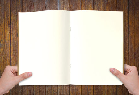 Hands holding bookの写真素材