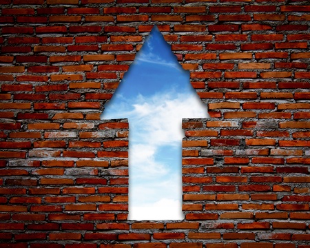 Brick wall with up arrow ,sky.の写真素材