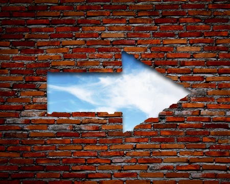 Brick wall with up arrow ,sky.の写真素材