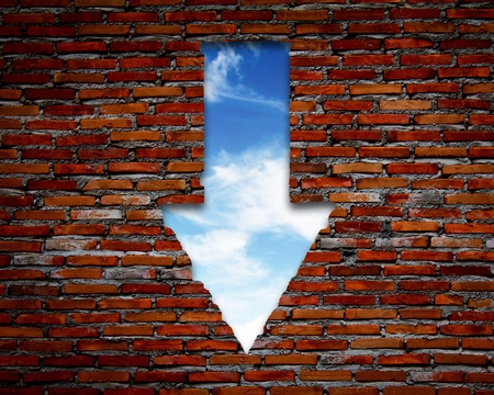 Brick wall with up arrow ,sky.の写真素材