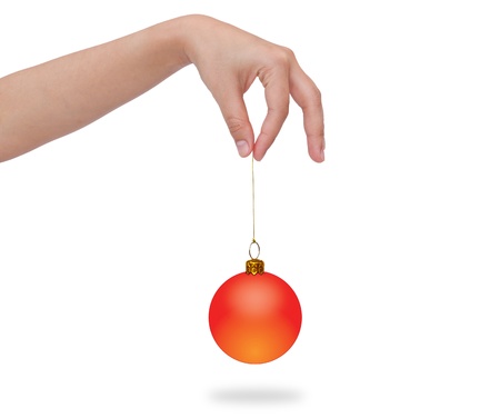 Human hand holding christmas ballの写真素材