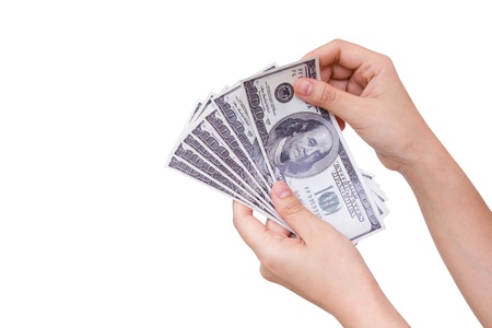 Hands holding dollars isolated on white backgroundの写真素材