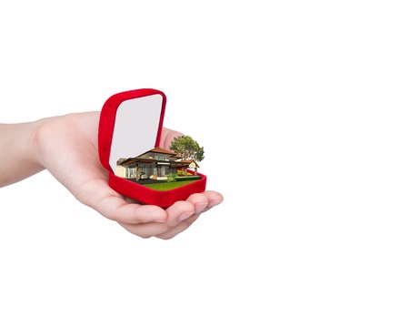 House in ring box on handの写真素材