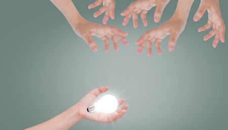Women hand with lamp bulbの写真素材