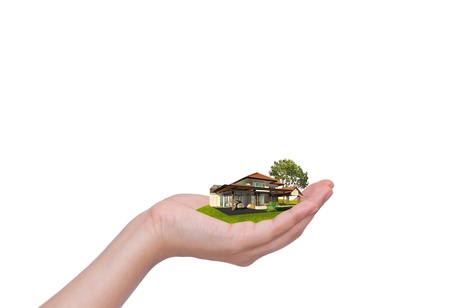 Hand holding new houseの写真素材