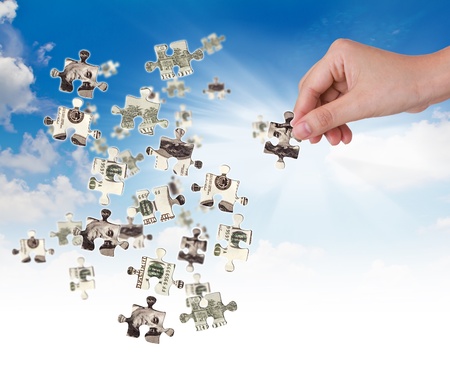 Hands and dollar money puzzleの写真素材