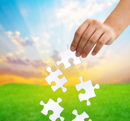 Hands and puzzleの写真素材