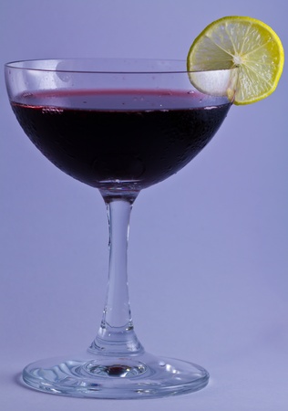 glasses of red wine with lemonの写真素材
