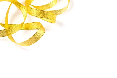 Shiny gold satin ribbon frame on white background with copy spaceの写真素材