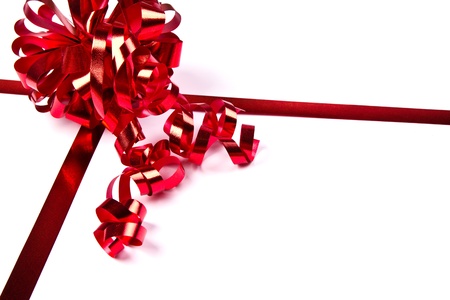Red ribbon with bow on white backgroundの写真素材