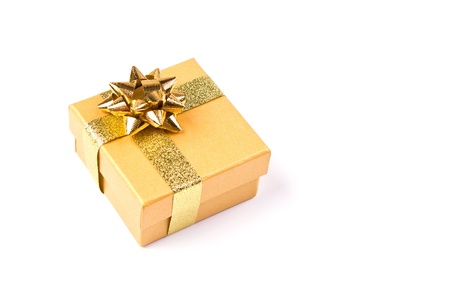 Golden gift box with golden ribbonの写真素材