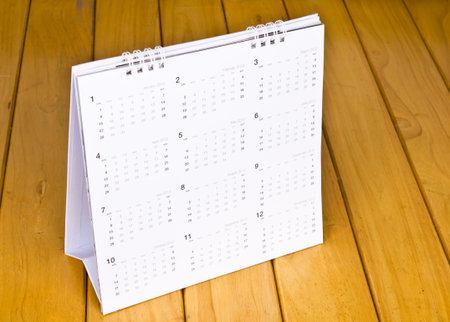Desktop calendar 2012 on wooden table