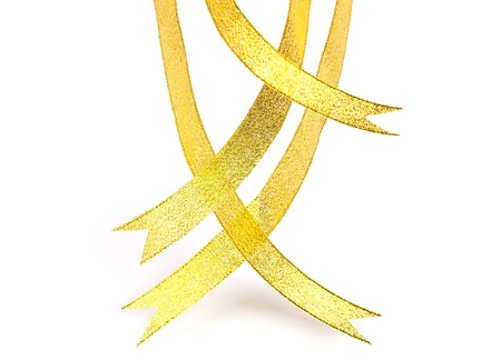 Gold ribbons hanging down on white backgroundの写真素材