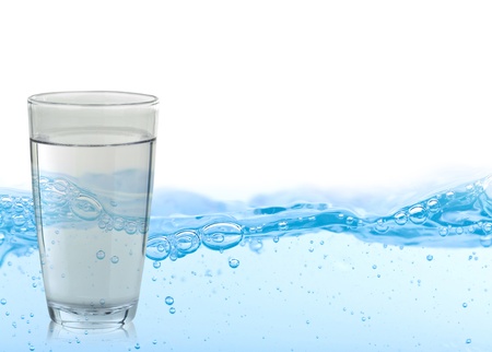 Pouring water on a glassの写真素材