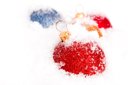 Blue ,red and gold christmas balls with snowの写真素材