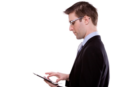 Portrait of young business man using a touch screen device against white backgroundの写真素材