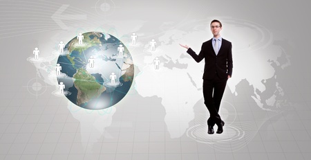 Social Network concept :young business man holding earth of social networkの写真素材