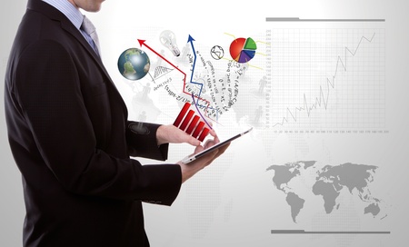 Business man using a touch screen deviceの写真素材