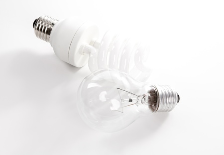 Tungsten and energy saving lightbulb on white backgroundの写真素材
