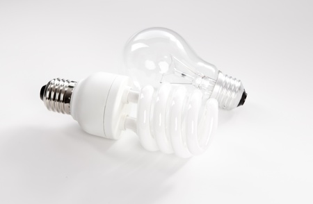 Tungsten and energy saving lightbulb on white backgroundの写真素材