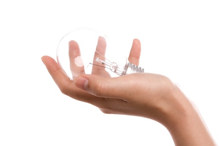 Light bulb in hand isolated on a white backgroundの写真素材