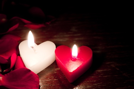 Valentines candles on rose petals backgroundの写真素材