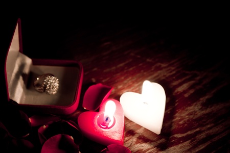 Valentines candles on rose petals backgroundの写真素材