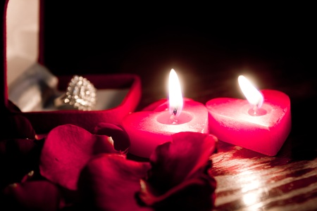 Valentines candles on rose petals backgroundの写真素材