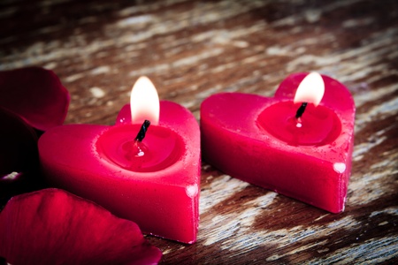 Valentines candles on rose petals backgroundの写真素材