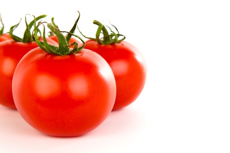 Tomatoes over white backgroundの写真素材