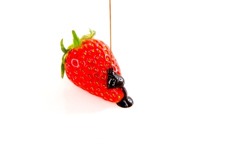 Fresh strawberry covered in dark chocolateの写真素材