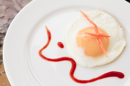 Fried egg on a plateの写真素材