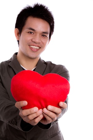 Business man with red heart isolated on whiteの写真素材