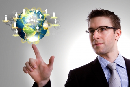 Social Network concept : young business man point earth of social networkの写真素材
