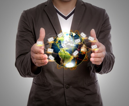 Business man hold earth of mailの写真素材