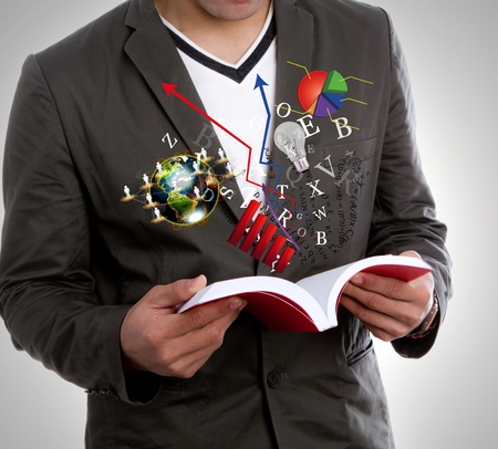 Young man reading bookの写真素材