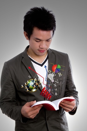 Young man reading bookの写真素材