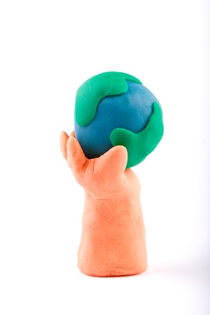 Plasticine of hand holding the Earthの写真素材