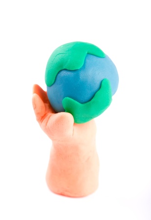 Plasticine of hand holding the Earthの写真素材