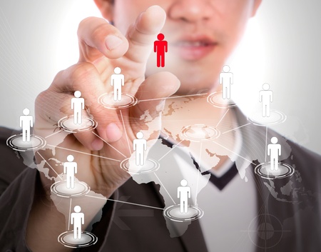 Social Network concept : young business man point to social network and world mapの写真素材