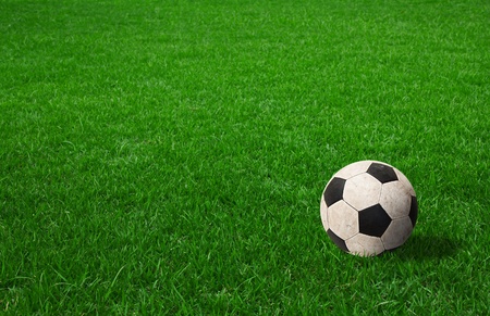 soccer ball on green grassの写真素材
