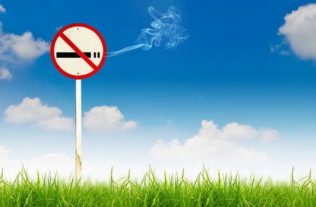 No smoking sign on fresh spring green grassの写真素材