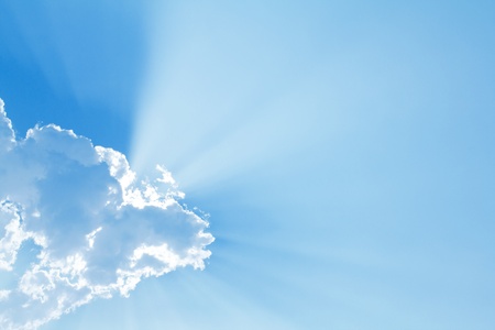 Blue sky with sun and beautiful cloudsの写真素材