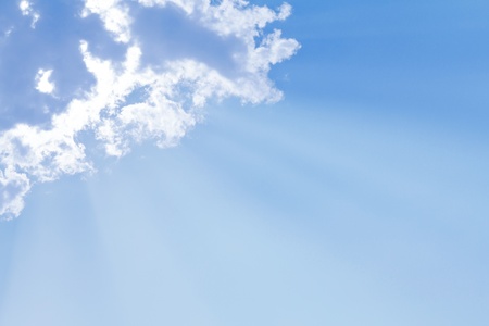 Blue sky with sun and beautiful cloudsの写真素材