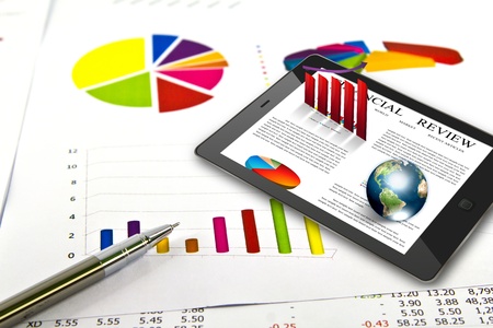 Touch pad and financial Graphs  (Elements of this image furnished by NASA)の写真素材