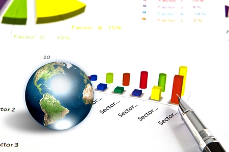 Pen and business graph with earth (Elements of this image furnished by NASA)の写真素材