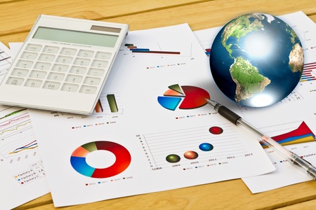 Pen and business graph with earth (Elements of this image furnished by NASA)の写真素材